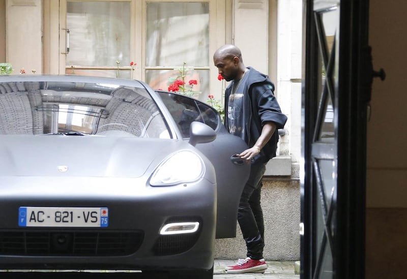 Rapper Kanye West boards his car in Paris on May 20, 2014. Gonzalo Fuentes / Reuters