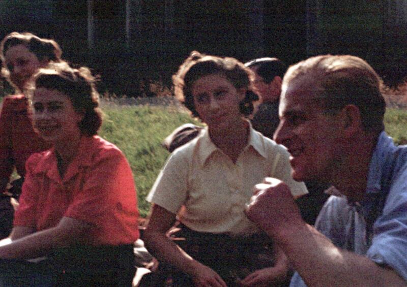 Princess Margaret, Princess Elizabeth and Prince Philip at a picnic at Balmoral in 1946.