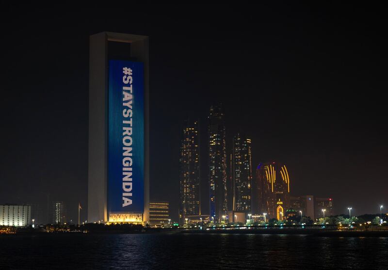 Indian flag projected on ADNOC Headquarters Building at the Corniche, Abu Dhabi in support during the COVID pandemic situation in India on April 25, 2021. Victor Besa / The National
Section: News