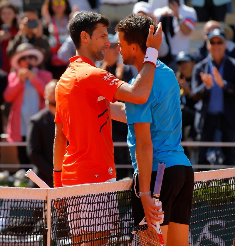 Serbia's Novak Djokovic, left, congratulates Austria's Dominic Thiem with winning his semifinal match of the French Open tennis tournament at the Roland Garros stadium in Paris, Saturday, June 8, 2019. (AP Photo/Michel Euler)