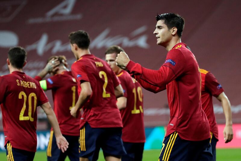 Alvaro Morata celebrates with teammates. EPA