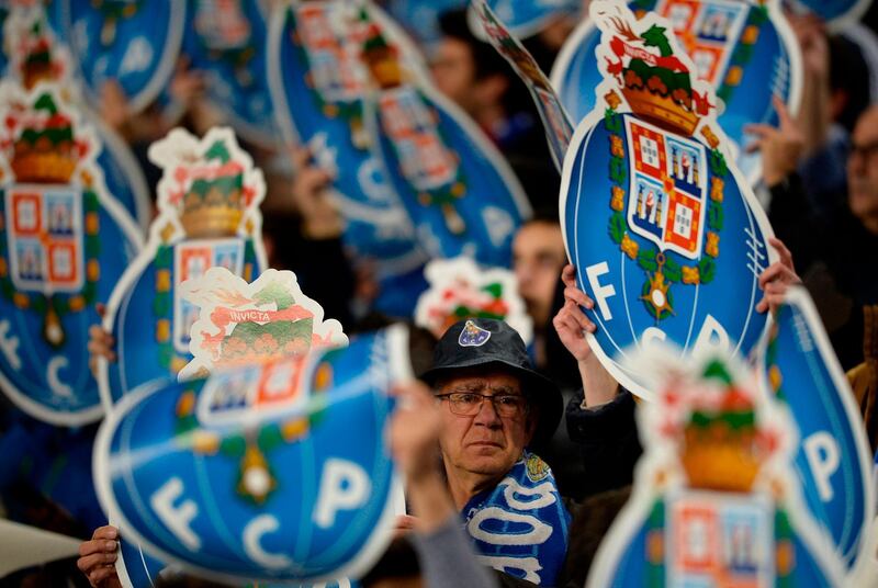 Porto supporters cheer their team before the start of their Uefa Champions League last-16 second-leg match against Roma at the Dragao Stadium in Porto on Wednesday night. Miguel Riopa / AFP