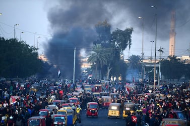 Smoke clouds rise during clashes between protesters and riot police following a protest at Al-Tayaran square in central Baghdad, Iraq, 20 January 2020. EPA