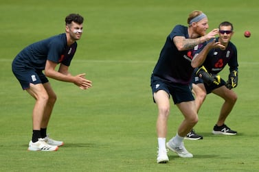 England captain Ben Stokes catches in the slips alongside Dom Sibley, coach Chris Read and Zak Crawley during a nets session at Ageas Bowl. Getty