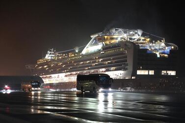 Buses with passengers believed to be US citizens drive away from the 'Diamond Princess' cruise ship docked in Yokohama, Japan, on Monday, February 17, 2020. Bloomberg