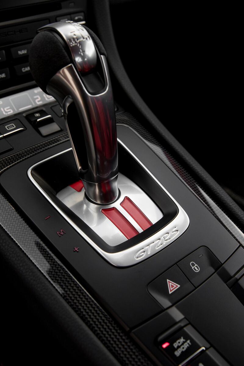 A single button will disengage both the electronic stability control and traction control. Porsche