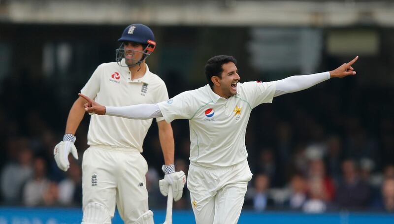 Pakistan's Mohammad Abbas celebrates after taking the wicket of England's Mark Stoneman, as England's Alastair Cook looks on in the background, during the first day of play of the first test cricket match between England and Pakistan at Lord's cricket ground in London, Thursday, May 24, 2018. (AP Photo/Alastair Grant)