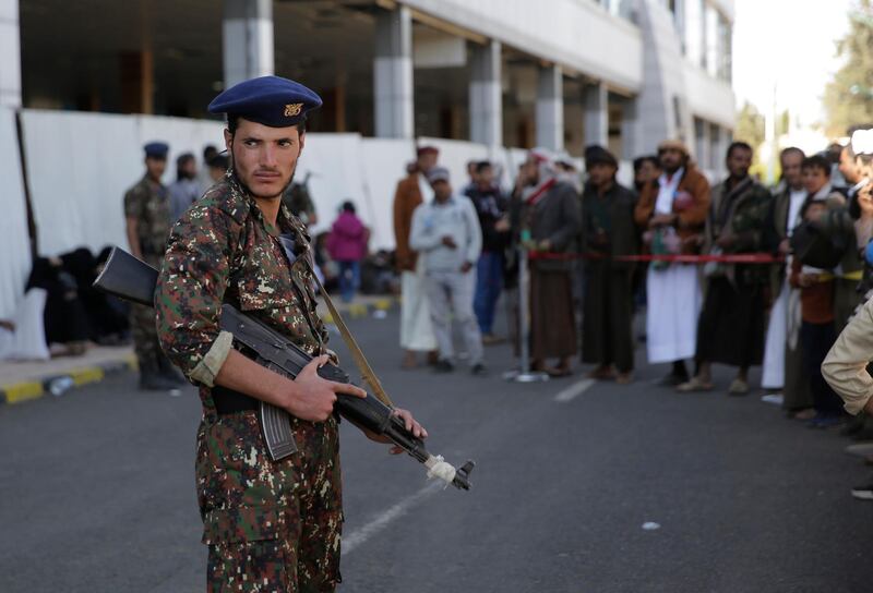 A Yemeni soldier stands guard at Sanaa Airport during arrival of Houthi prisoners after being released by the Saudi-led coalition in the airport of Sanaa, Yemen, Thursday, Nov. 28, 2019. The International Committee of the Red Cross says over a hundred rebel prisoners released by the Saudi-led coalition have returned to Houthi-controlled territory in Yemen, a step toward a long-anticipated prisoner swap between the warring parties. (AP Photo/Hani Mohammed)