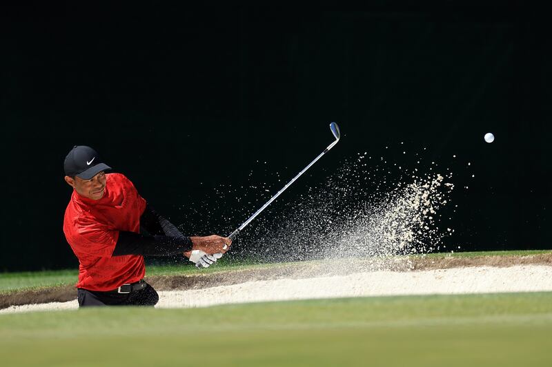 Tiger Woods plays his shot from the bunker on the fourth hole during the final round of the Masters at Augusta National Golf Club on April 10 in Georgia.  Getty / AFP