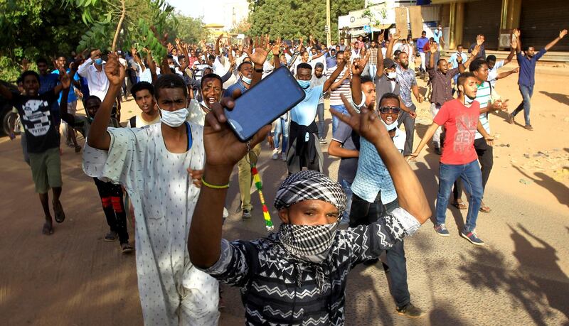 FILE PHOTO: Sudanese demonstrators chant slogans as they march along the street during anti-government protests in Khartoum, Sudan December 25, 2018. REUTERS/Mohamed Nureldin Abdallah/File Photo