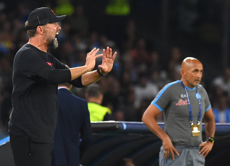 Liverpool manager Jurgen Klopp and Napoli's Luciano Spalletti on the touchline. PA