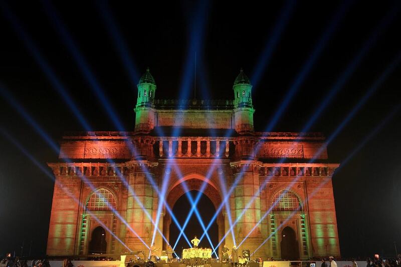 Above, the Gateway of India monument illuminated as a part of a new state tourism initiative in Mumbai. Punit Paranjpe / AFP