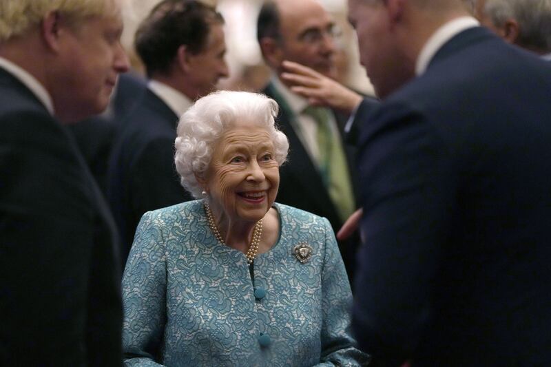 Queen Elizabeth speaks with guests.