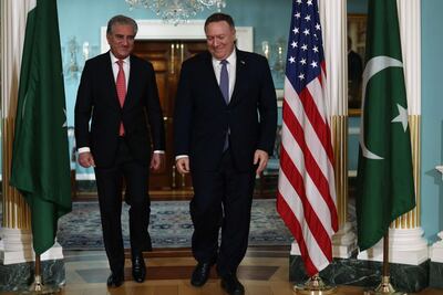 WASHINGTON, DC - JANUARY 17: U.S. Secretary of State Mike Pompeo waves as he welcomes Pakistani Foreign Minister Shah Mehmood Qureshi at the State Department January 17, 2020 in Washington, DC. The two counterparts met to discuss bilateral issues. Foreign Minister Shah Mehmood Qureshi has expressed his support of continued American engagement in Afghanistan for rebuilding efforts.   Alex Wong/Getty Images/AFP
== FOR NEWSPAPERS, INTERNET, TELCOS & TELEVISION USE ONLY ==
