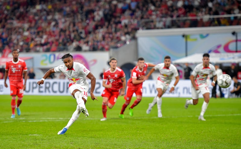RB Leipzig's Christopher Nkunku scores their second goal from the penalty spot. Reuters