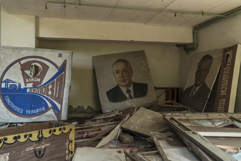 Posters and portraits are seen in a building. Getty Images