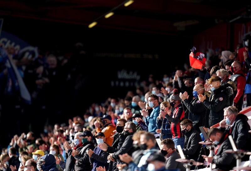 AFC Bournemouth fans applaud as the teams make their way out to the pitch ahead of the Championship match at the Vitality Stadium on Monday, May 17, 2021. Fans returned to sporting events following further easing of lockdown restrictions in England. PA