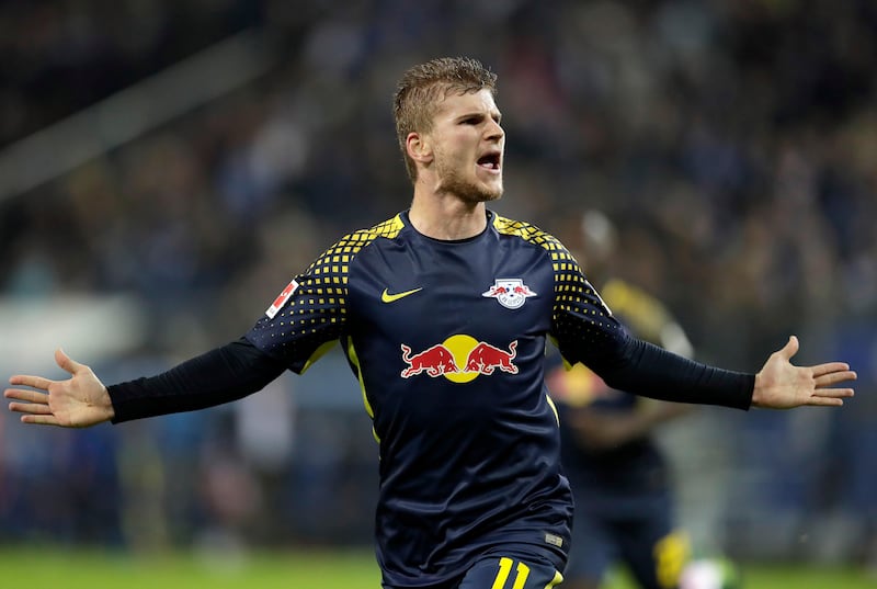 Leipzig's Timo Werner celebrates after scoring his side's 2nd goal during the German Bundesliga soccer match between Hamburger SV and RB Leipzig in Hamburg, Germany, Friday, Sept. 8, 2017. (AP Photo/Michael Sohn)