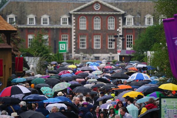 RHS Chelsea Flower Show in full bloom – umbrellas as much as flowers –on Tuesday.