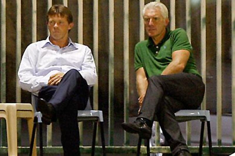 Franky Vercauteren, left, and his assistant head coach, Hugo Broos, watch their team practise ahead of the Super Cup.