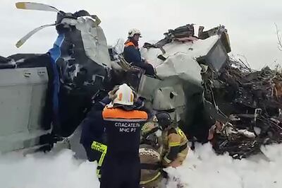 An image taken from a handout video showing rescuers working at the crash site of the L-410 plane crash near the town of Menzelinsk in the Republic of Tatarstan. Russian Emergency Ministry/AFP