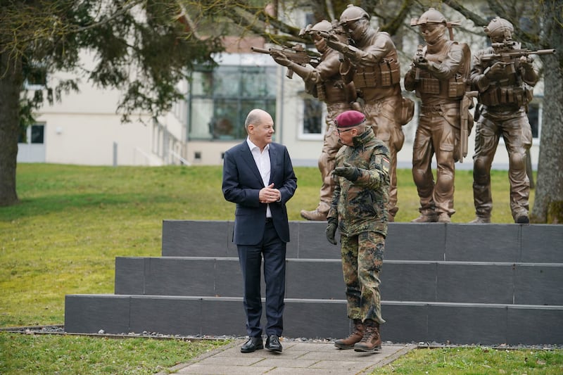 Mr Scholz and Brig Gen Ansgar Meyer at the KSK training site, in Calw. Getty Images