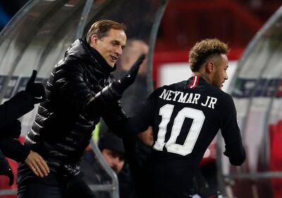 FILE - In this Tuesday, Dec. 11, 2018 file photo, PSG coach Thomas Tuchel, left, congratulates PSG forward Neymar after he scored his side' second goal during the Champions League group C soccer match between Red Star and Paris Saint Germain, in Belgrade, Serbia. PSG travels to face Manchester United on Feb. 12, 2019 without the Brazil forward, who faces around 10 weeks out. With Neymar so influential to the way PSG plays, it means coach Thomas Tuchel must have a tactical re-think.  (AP Photo/Darko Vojinovic, File)