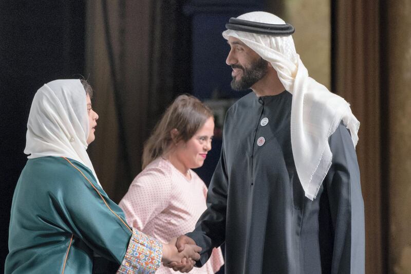 ABU DHABI, UNITED ARAB EMIRATES - March 13, 2019: HH Sheikh Nahyan Bin Zayed Al Nahyan, Chairman of the Board of Trustees of Zayed bin Sultan Al Nahyan Charitable and Humanitarian Foundation (R), greets Special Olympics athlete, Samia Siddik (L), after a lecture by Loretta Claiborne, Chief Inspiration Officer, Vice Chair of the Special Olympics International Board of Directors (not shown), titled "Changing the Game for Inclusion", at Emirates Palace. 
( Ryan Carter / Ministry of Presidential Affairs )?