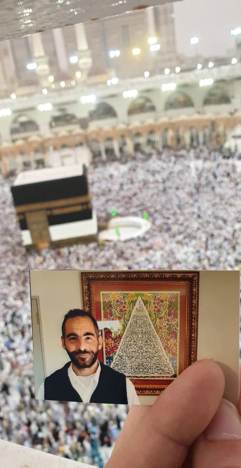 A photo of Hussein Al Umari, a victim of the Christchurch mosques shootings, carried by his sister Aya while performing Umrah for her brother. Courtesy of Aya Al Umari