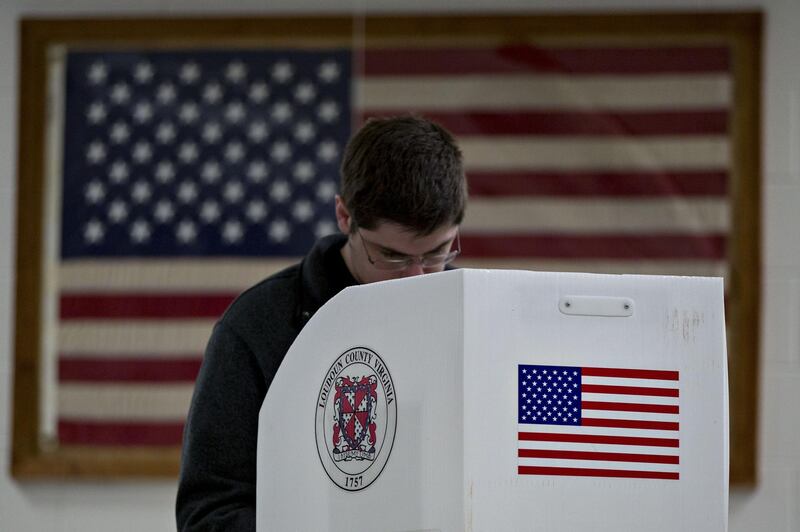 A voter casts a ballot at a polling station in Leesburg, Virginia. Bloomberg