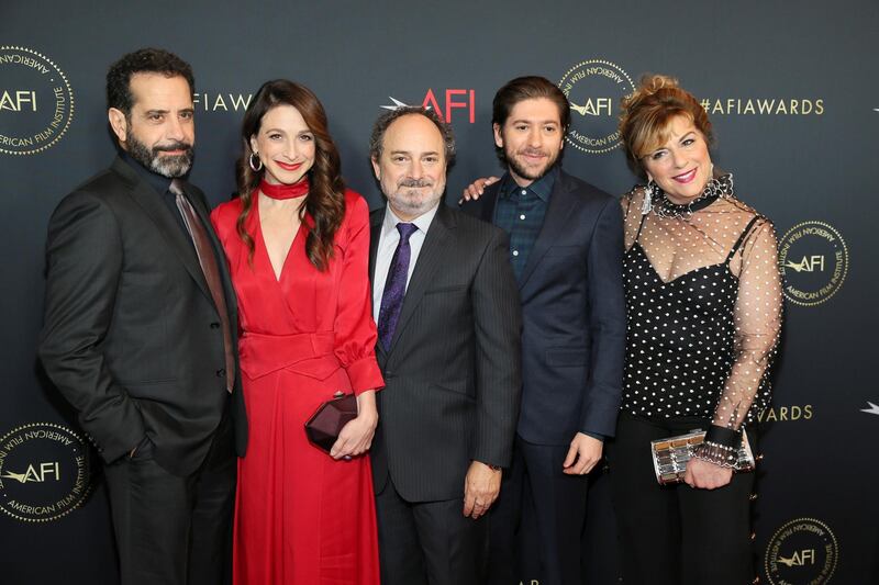 Actors Tony Shalhoub, Marin Hinkle, Kevin Pollak, Michael Zegen and Caroline Aaron - the cast of 'The Marvelous Mrs. Maisel' - all look smart as they line up together on the red carpet. REUTERS