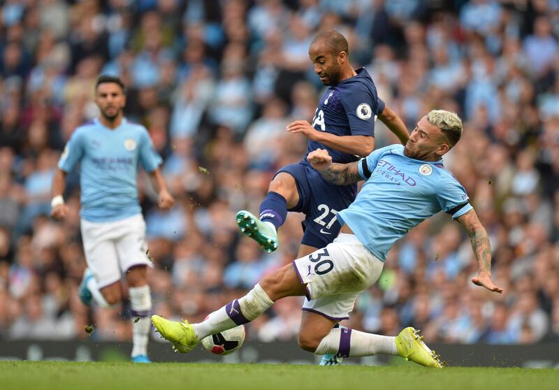 Manchester City's Nicolas Otamendi (R) in action against Tottenham Hotspurs Lucas Moura (C) during the English Premier League soccer match between Manchester City and Tottenham Hotspurs at the Etihad Stadium in Manchester, Britain. EPA