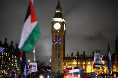 An anti-war message is projected on to Big Ben during a protest outside London's Houses of Parliament. AFP