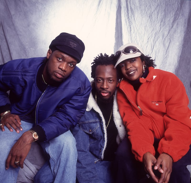 Portrait of American Hip Hop group Fugees as they pose backstage at the Allstate Arena, Rosemont, Illinois, September 2, 1997. Pictured are, from left, Pras, Wyclef Jean, and Lauryn Hill. (Photo by Paul Natkin/Getty Images)
