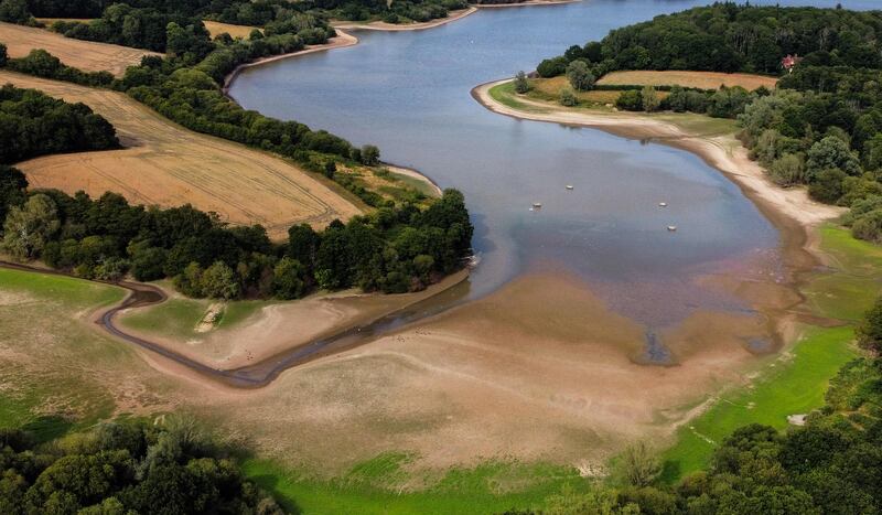 The reduced water level at Weir Wood reservoir, near Crawley, south-east England. The UK's Met Office has issued its first 'red warning' for exceptional heat. AFP