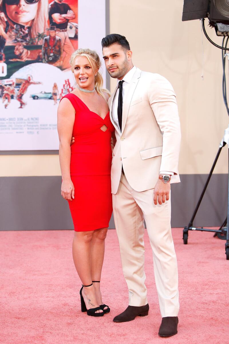 epa07734554 US singer Britney Spears (L) and boyfriend Sam Asghari arrive for the premiere of 'Once Upon a Time in Hollywood' at the TCL Chinese Theatre IMAX in Hollywood, Los Angeles, California, USA, 22 July 2019. The movie opens in the US on 26 July 2019.  EPA-EFE/NINA PROMMER