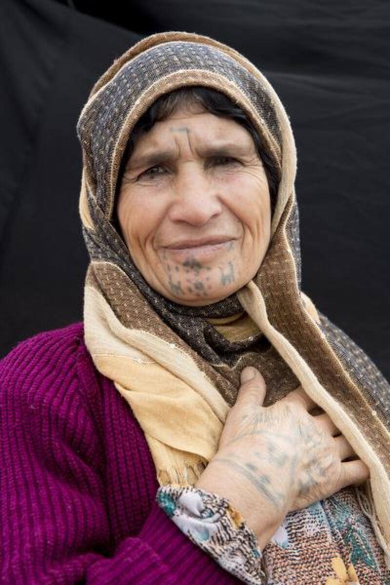 Amina Saleh, 60 year-old woman from Musko, a village of Kobani. Mother of six, she had her face tattooed when she was about 10 years old.