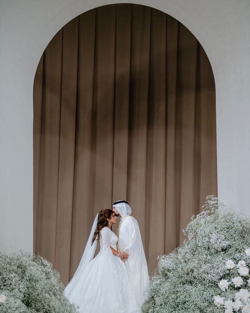 Sheikha Mahra's heavily embroidered white gown features thousands of Swarovski crystals