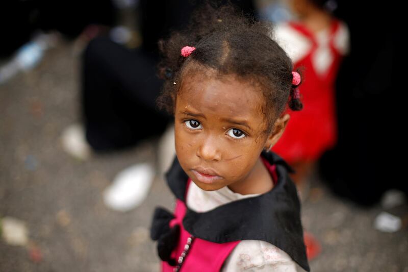 A girl waits at a charity clinic near their neighbourhood in Sanaa, Yemen. Reuters