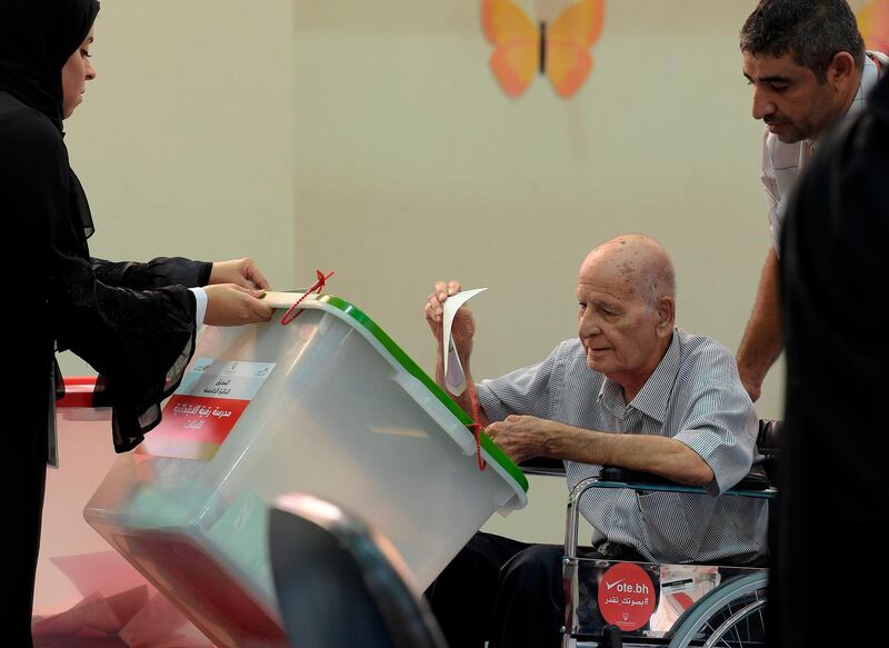 A Bahraini voter casts his ballot at a polling station in the city of Al-Muharraq, north of Manama on November 24, 2018. AFP