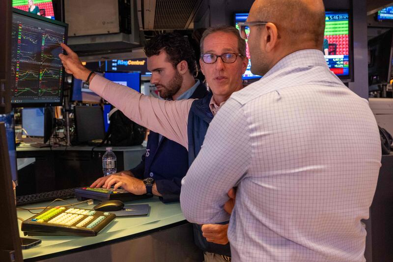 Traders on the floor of the New York Stock Exchange. Some market watchers are now predicting that the sell-off in the bond markets will force share prices to crash. AFP