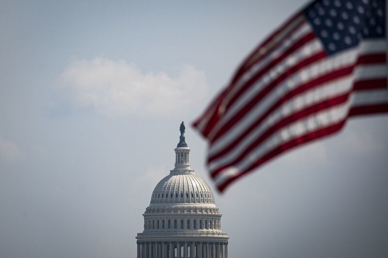 An American flag flies at half staff, following the death of US  members of the military in Afghanistan, near the US Capitol in Washington, August  27. Bloomberg