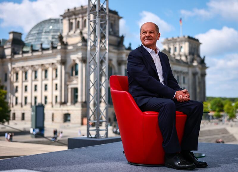 German Chancellor Olaf Scholz arrives for the traditional summer interview with German public broadcaster ARD, in front of the Reichstag in Berlin. EPA