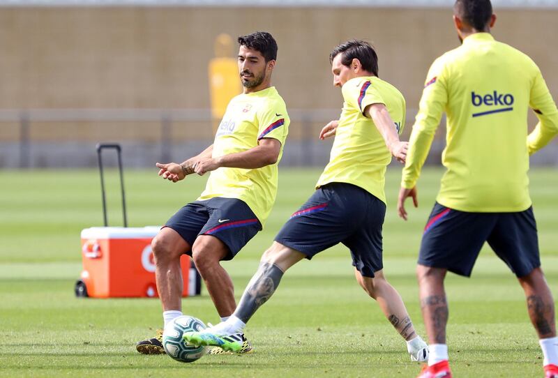 Leo Messi and Luis Suarez during a training session at Joan Gamper Sports City. EPA