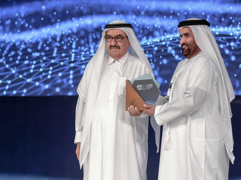 Dubai, United Arab Emirates, March 11, 2019.  The UAE is celebrating 30 years of signing Double Taxation Avoidance Agreements (DTA) and Bilateral Investment Treaties (BIT). -- (L-R)  H.H. Hamdan bin Rashid Al Maktoum, Minister of Finance gives an award to HE Mohammed Ali bin Zayed Al Falasi, Deputy Governor of the UAE Central Bank. 
Victor Besa/The National
Reporter:  Nada El Sawy
Section:  BZ