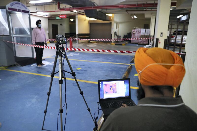 DUBAI, UNITED ARAB EMIRATES , June 30 – 2020 :- Thermal camera installed to check the temperature of the visitors inside the Gurunanak Darbar in Jebel Ali in Dubai. Places of worship opening up tomorrow in the UAE. (Pawan Singh / The National) For News. Story by Ramola