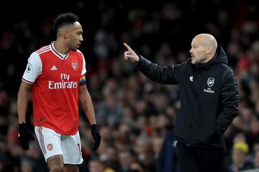 Freddie Ljungberg, the caretaker Arsenal coach, speaks with Pierre-Emerick Aubameyang during the Premier League defeat at home to Brighton. Getty