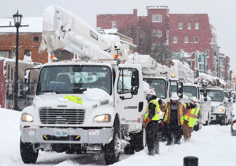 Utility company vehicles line up in Buffalo. The Buffalo News / AP