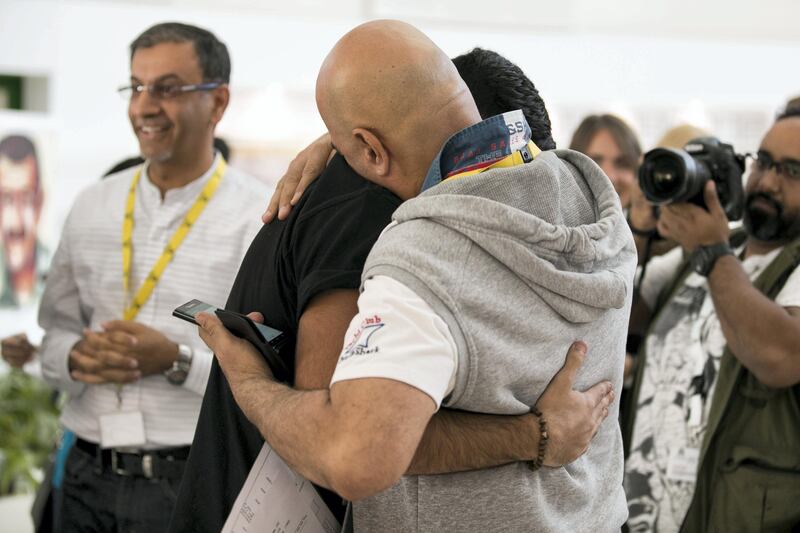 DUBAI, UNITED ARAB EMIRATES - AUG 17: 

 Mario Aoun embraces his dad, Antonie, in joy upon learning his A-level examination results at Jumeirah College School 


(Photo by Reem Mohammed/The National)

Reporter:  Caline Malek
Section: NA