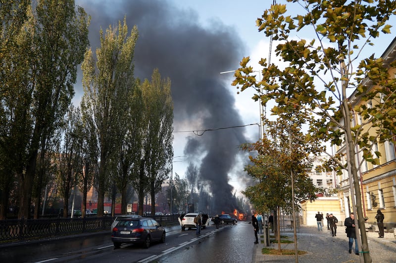 Thick smoke billows over central Kyiv after at least two blasts took place in the city shortly after 8am local time. Reuters